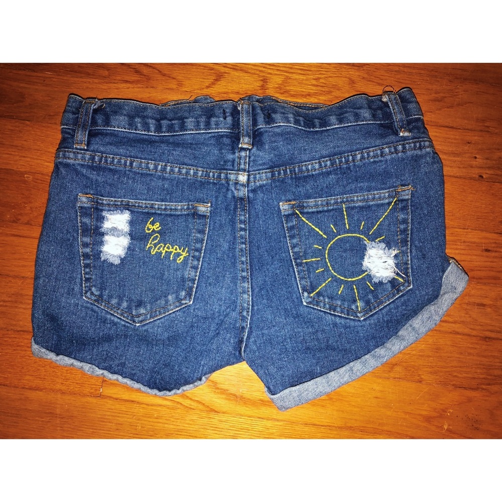 DISTRESSED HIGHWAISTED HAND EMBROIDERED SHORTS